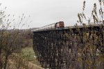 BNSF 7875 leads westbound covered hopper train over the Gassman Coulee Trestle